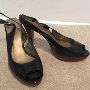 Navy patent leather peep toe pumps by Marc Fisher